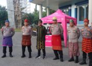 Hadiri HUT Kota Bima Ke 24, Kapolres Bima Kabupaten Kenakan Sarung Tenun Khas Bima